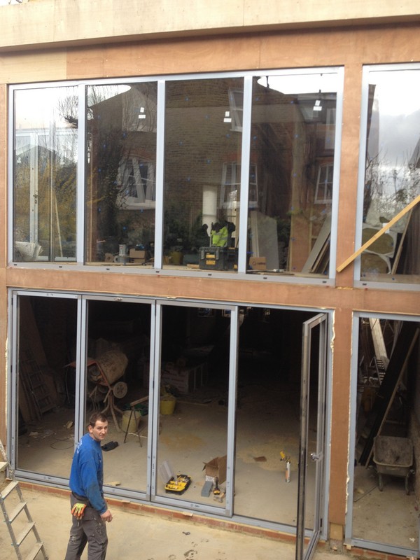 Aluminium bi-fold doors with two-storey glazing in Holloway