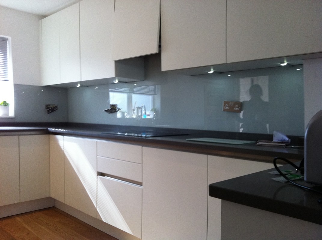 Grey glass kitchen splashback with LED lighting in Holloway