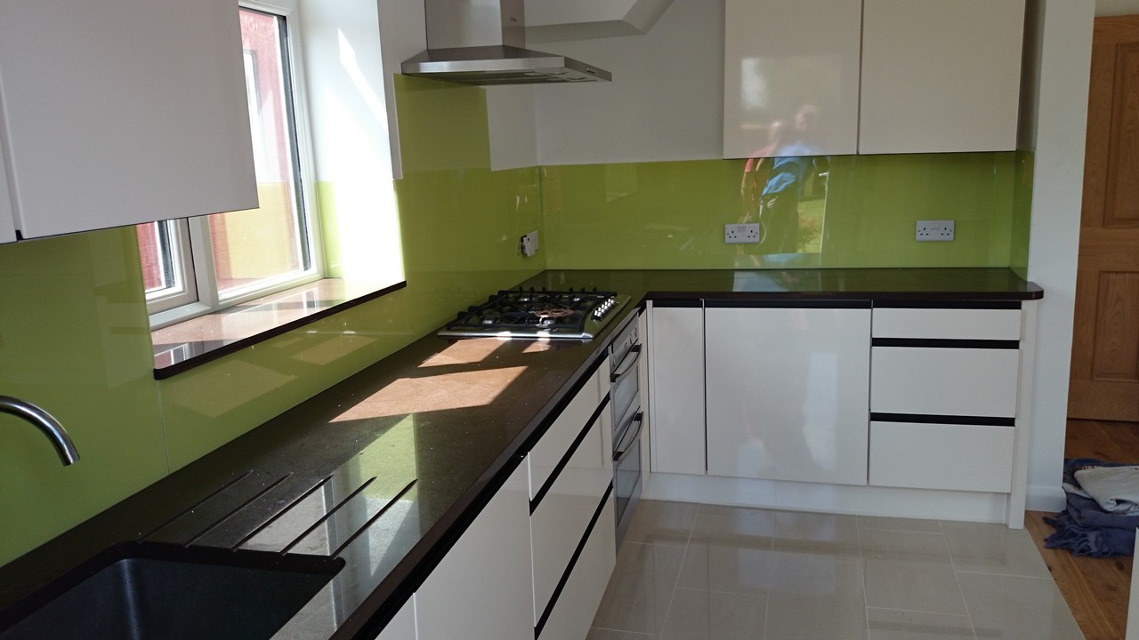 Lime green glass kitchen splashback installed by Holloway glaziers