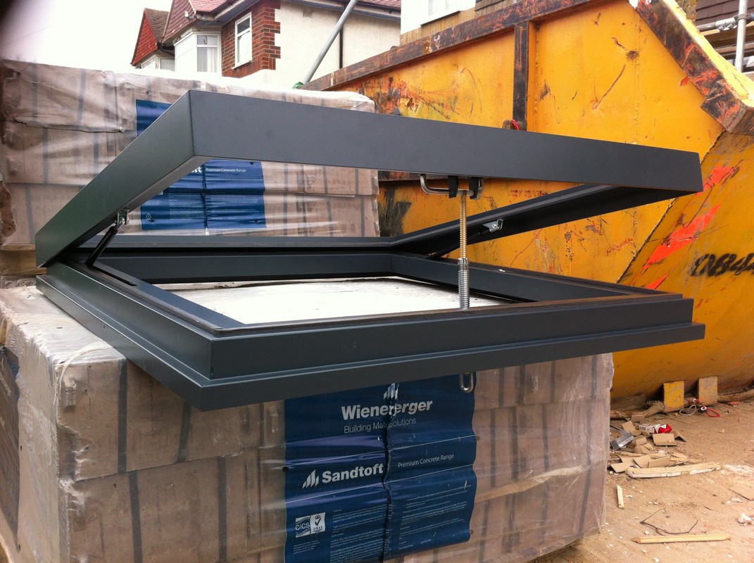 Opening flat roof skylight in anthracite grey installed in Holloway